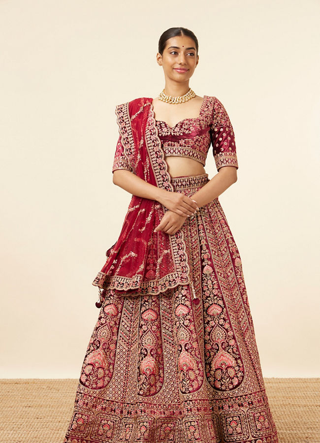 alt message - Mohey Women Maroon Embellished Bridal Lehenga image number 0